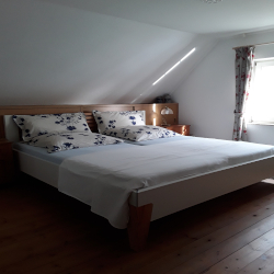 Ferienhaus Wischhof Walksfelde - Altes Backhaus Schlafzimmer mit Doppelbett
